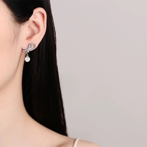 Elegant S925 silver bowknot earrings with round pearls and sparkling moissanite stones
