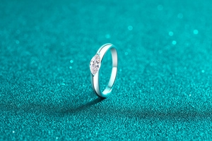 Macro view of marquise cut moissanite on a polished S925 sterling silver ring band