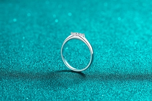 Macro side view of marquise cut moissanite ring set in S925 sterling silver band