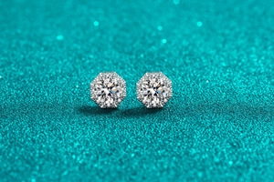 Macro shot of geometric S925 silver stud earrings featuring circular moissanite halo stones