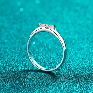 S925 sterling silver ring with marquise cut moissanite in a minimalist 4-prong setting