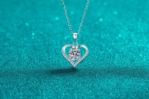 Detailed view of a S925 sterling silver heart pendant with a brilliant moissanite stone