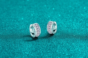 Close-up of S925 silver hoop earrings with baguette-cut moissanite in a pave setting