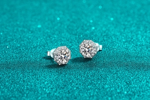 Macro view of hexagonal S925 silver stud earrings with moissanite halo stones