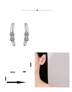 Close-up of S925 silver moissanite curved stud earrings shown on model ear for detail