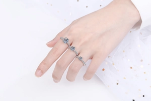 Close-up of three S925 sterling silver rings with round brilliant-cut moissanite stones