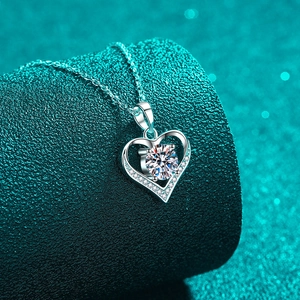 925 silver heart pendant necklace with moissanite center stone on high-end background