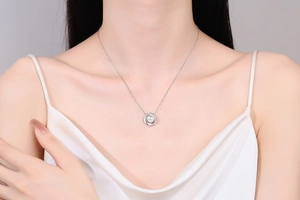 Close-up of S925 silver necklace with concentric circles moissanite and round white pearl