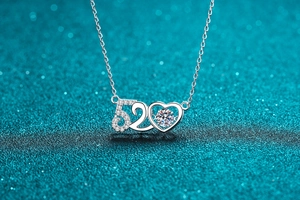 Detailed view of S925 silver 520 heart pendant with sparkling round moissanite stone