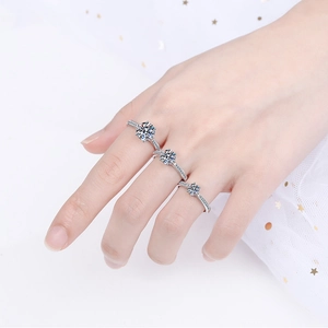 Three S925 sterling silver rings with round Moissanite stones in graduated sizes