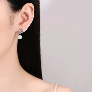Elegant S925 silver crescent moon stud earrings with lustrous white pearls for women
