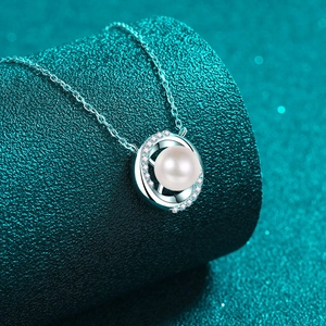 Elegant S925 silver necklace with a round pearl in a diamond-set swirl pendant