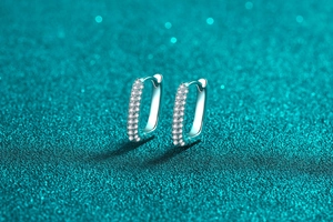 Close-up of S925 sterling silver rectangular hoop earrings with pavé moissanite stones