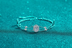 Macro shot of 925 sterling silver double-layer bracelet with oval moissanite and halo stones