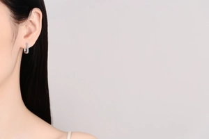 Close-up of minimalist S925 sterling silver hoop earrings with double-row micro pavé moissanite