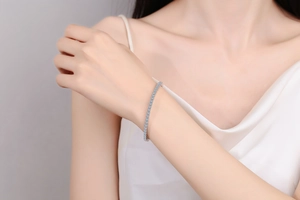 Close-up of S925 sterling silver tennis bracelet with sparkling blue moissanite stones