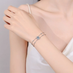 925 silver moissanite bracelet with oval centerpiece and double chain worn by model