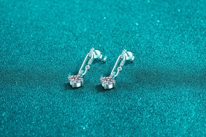 Detailed macro view of S925 sterling silver paperclip earrings with moissanite tassels