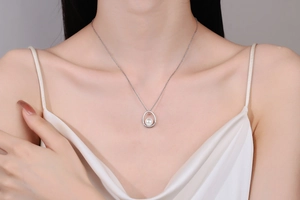 Close-up of S925 silver necklace featuring a water-drop pendant with a glowing white pearl