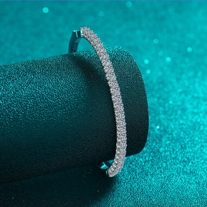 Luxurious S925 silver tennis bracelet featuring micro-pave moissanite stones on dark base