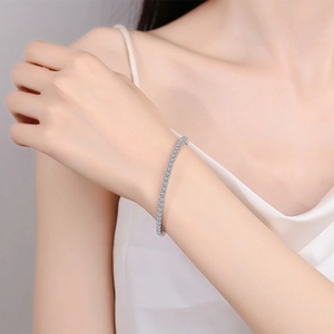 Sparkling S925 sterling silver tennis bracelet with moissanite stones on a woman's wrist