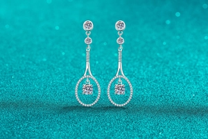 Close-up of S925 sterling silver drop earrings featuring moissanite stones and long fringe