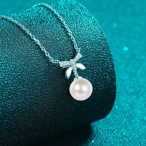 Elegant S925 silver necklace with bow pendant featuring moissanite and round pearl