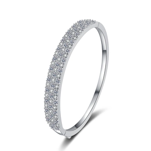 Elegant S925 sterling silver bangle with triple-row moissanite stones on white background