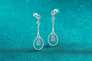 Macro detail of S925 sterling silver long drop earrings with moissanite crystals