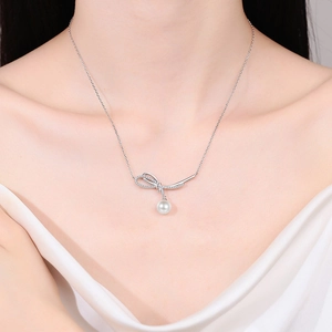 Elegant S925 silver bow pendant necklace with Moissanite and white pearl on model