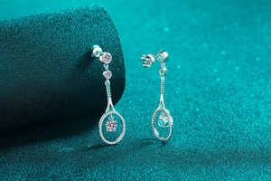 Macro detail of tennis racket earrings in S925 silver with sparkling moissanite stones