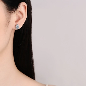 Elegant S925 sterling silver pear shaped moissanite stud earrings on female model