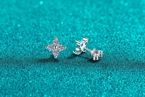 Close-up of S925 sterling silver clover stud earrings with bright cubic zirconia stones