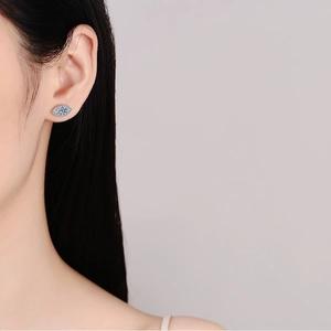 Sparkling S925 sterling silver oval moissanite stud earring worn by a model for a classy look