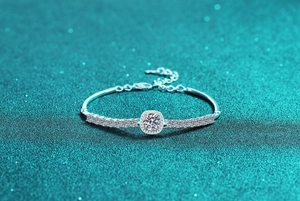 Macro view of S925 sterling silver moissanite bracelet with halo setting and adjustable chain