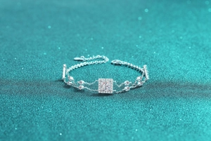 Macro shot of S925 sterling silver bracelet with square sapphire blue stone and halo diamonds