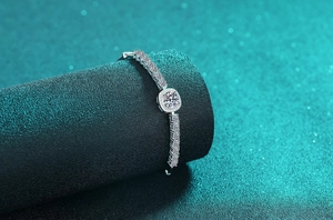 Macro view of S925 silver bracelet featuring round moissanite with square halo setting
