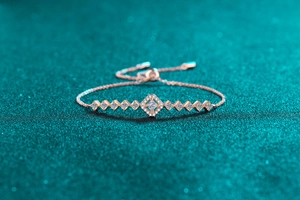Macro detail of rose gold geometric diamond bracelet with adjustable sliding clasp