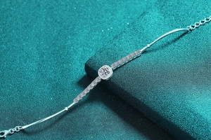 Detailed close-up of S925 sterling silver bracelet with halo moissanite and square setting