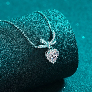 Luxurious S925 silver bow and heart pendant necklace with shimmering moissanite stones