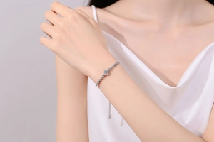 Detail of adjustable S925 silver bracelet featuring a square moissanite on model wrist