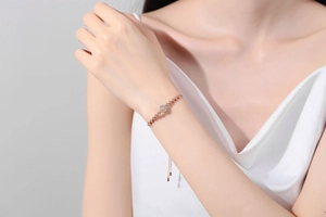 Detailed view of S925 sterling silver rose gold square bracelet with adjustable chain