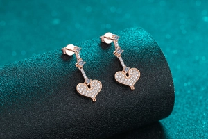 Macro shot of S925 silver heart drop earrings in champagne gold with sparkling moissanite