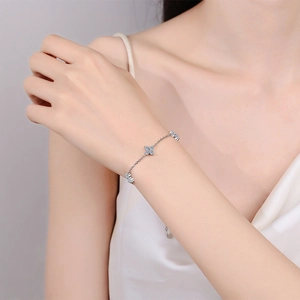 S925 sterling silver star bracelet with sparkling moissanite stones on a female wrist