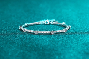 Macro view of S925 sterling silver moissanite bracelet with four-prong set round diamonds