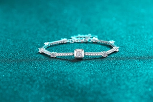 Macro view of S925 sterling silver bracelet with square moissanite and pave diamonds