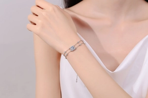 Detail view of double-layer S925 silver bracelet featuring square-cut moissanite stone