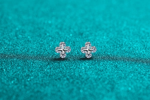 Macro detail of S925 sterling silver star earrings with brilliant moissanite stones