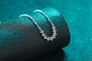 Close-up of S925 silver U-shape pendant with seven sparkling round white moissanite stones