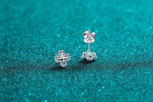 Macro shot of S925 sterling silver star stud earrings with round moissanite and butterfly back